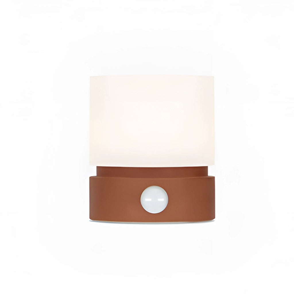 Cordless table lamp in cinnamon color with a rectangular wooden base, adjustable brightness, and a beige lampshade.