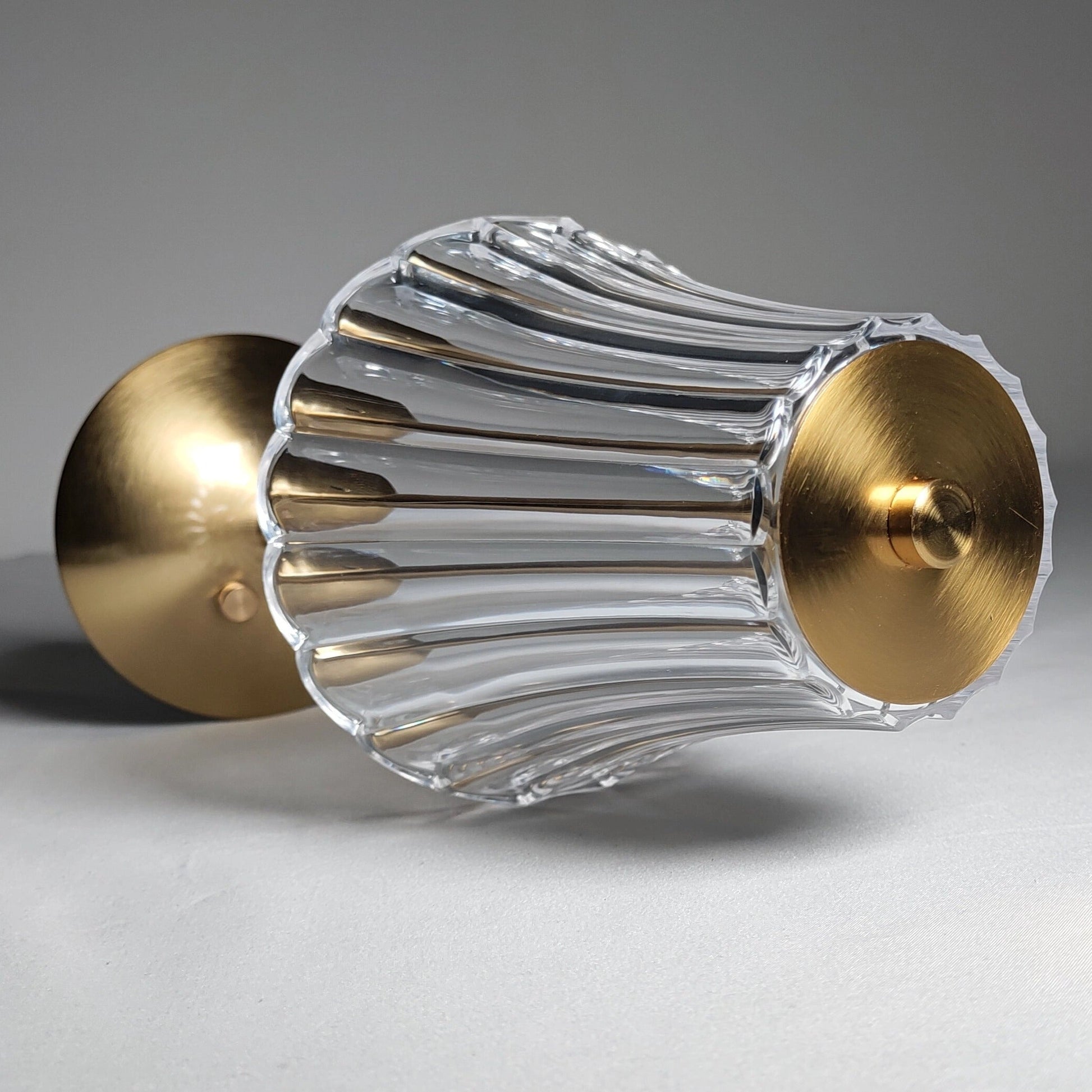 Cordless table lamp with metal base and amber-colored cylindrical shade featuring a durable and beautifully designed exterior.
