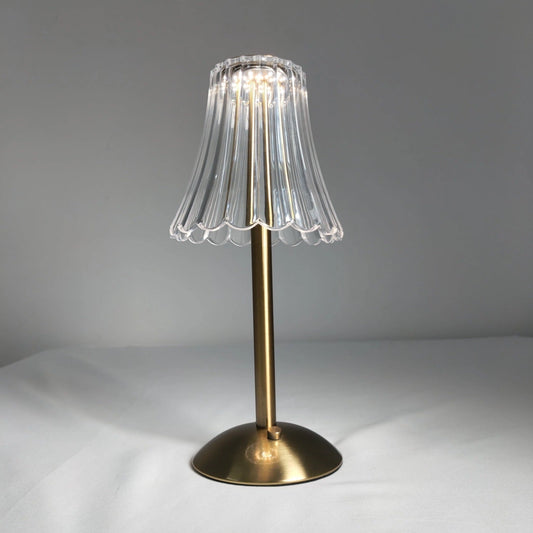 Cordless table lamp with a stylish design, featuring a wooden base, glass body, and metal accents, blending art and functionality.