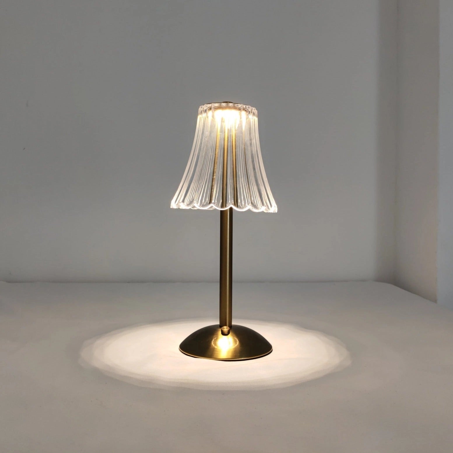 Cordless table lamp with a wooden base, glass lampshade, and elegant design, showcasing supreme durability and soft ambient light.