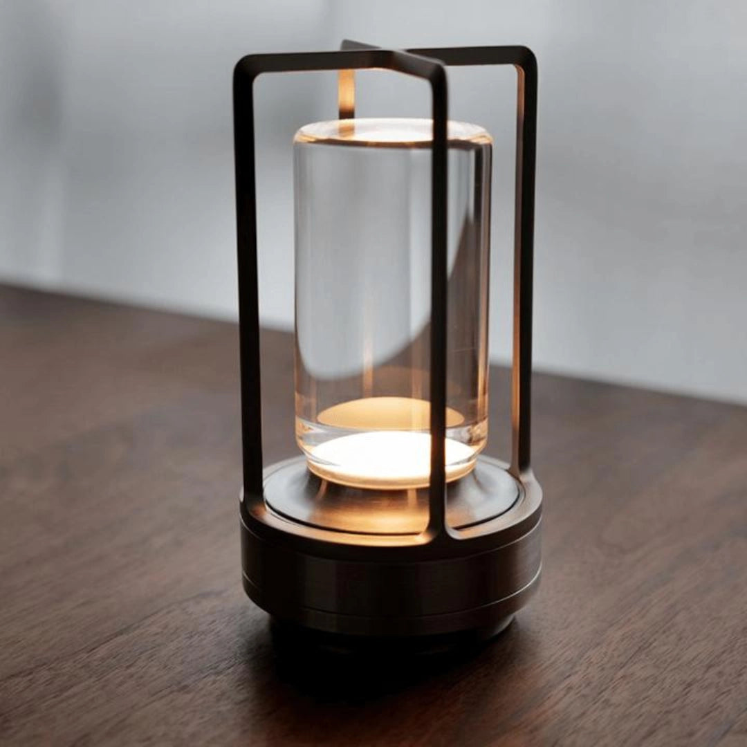 Crystal Lantern Table Lamp with Touch Sensor in Black, featuring a transparent glass body and metal accents, placed on a wooden surface.