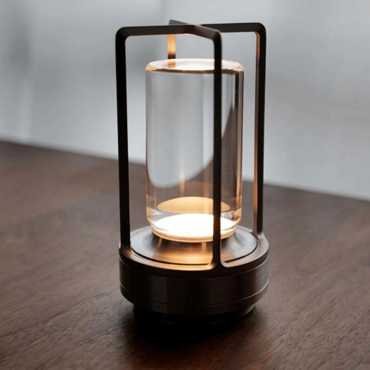 Crystal Lantern Table Lamp with Touch Sensor in Black, featuring a transparent glass body and metal accents, placed on a wooden surface.