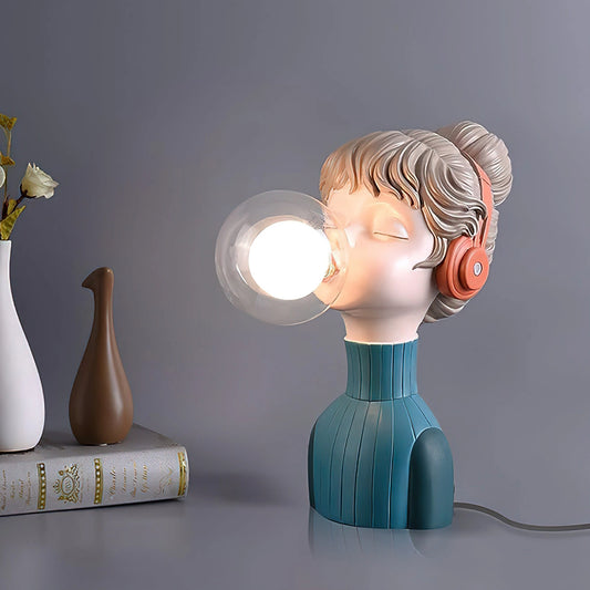A chic minimalist desk lamp with an orange and green resin design, featuring a sleek and modern aesthetic.