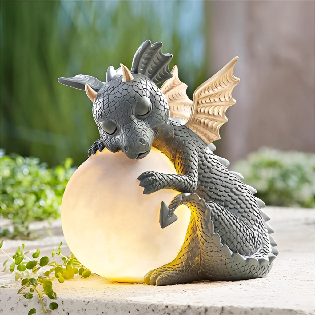 Dragon Shaped LED Table Lamp, Cozy dragon variant, depicting a mythical dragon sculpture with intricate wings, standing elegantly next to a small plant.