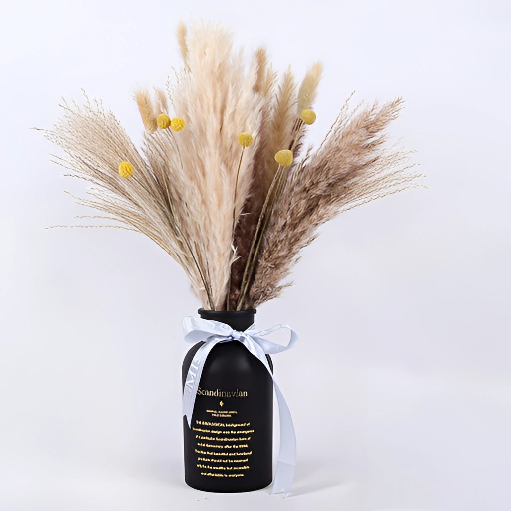 A 30-piece set of dried pampas grass flowers arranged in a decorative display, showcasing natural twigs and feather-like plumes in shades of beige and electric blue, ideal for interior decoration.