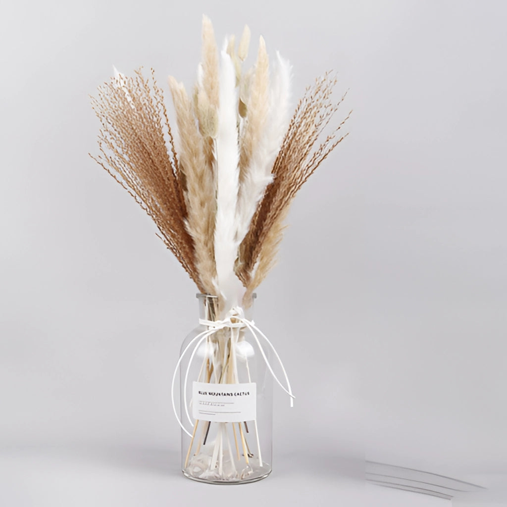 A 30-piece set of dried pampas grass flowers arranged as an interior decoration, displayed on a table with chairs in the background.