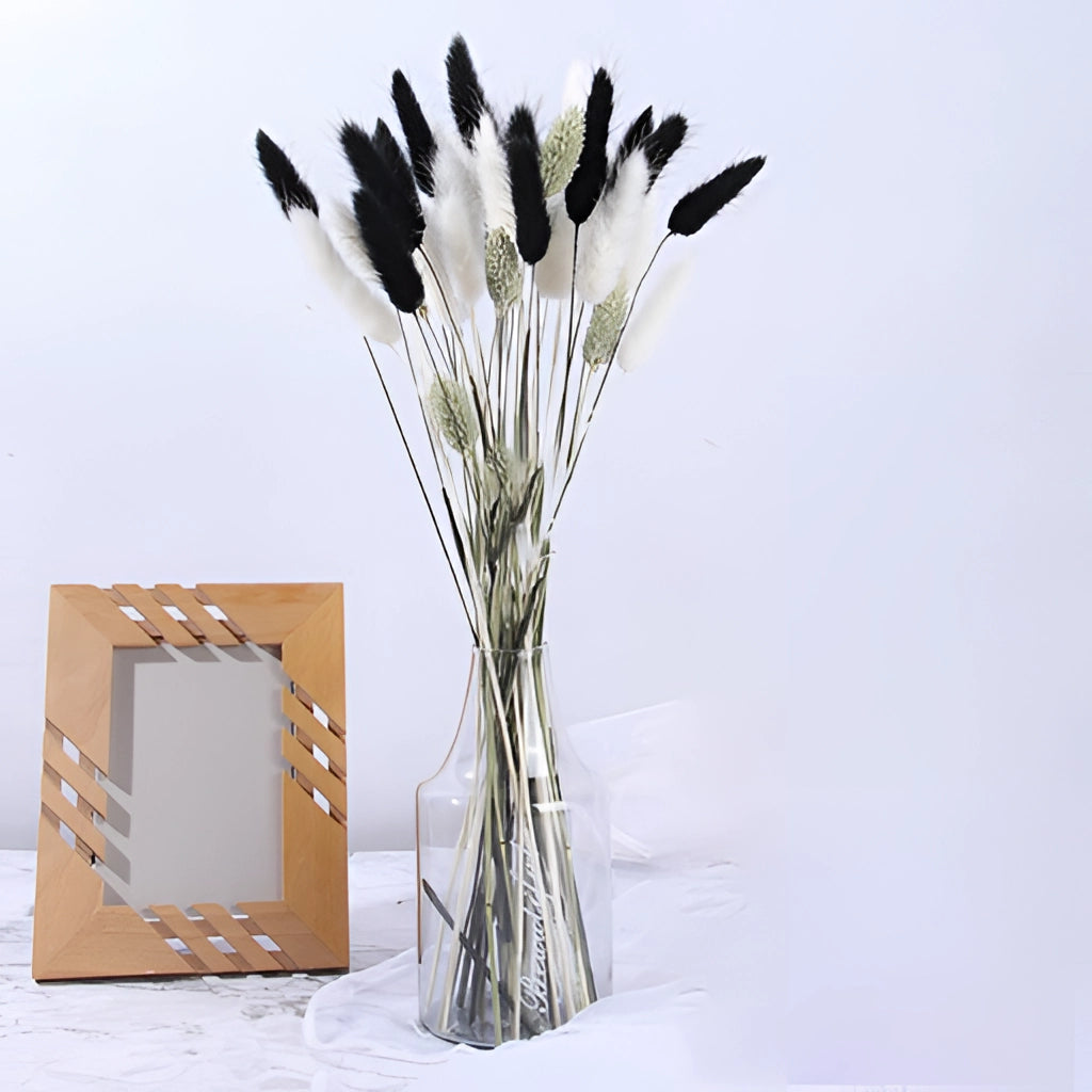 A 30-piece set of dried pampas grass flowers arranged in a vase, featuring natural wood and twig elements, suitable for interior decoration.