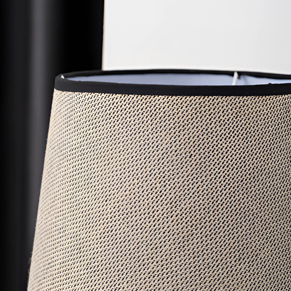 A grey elephant design lamp with a rechargeable battery placed on a wooden table.