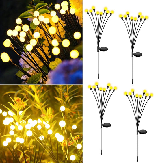 Enhanced Solar Powered 8 LED Lights Quad Pack displayed on green leaves and branches in a natural outdoor setting.