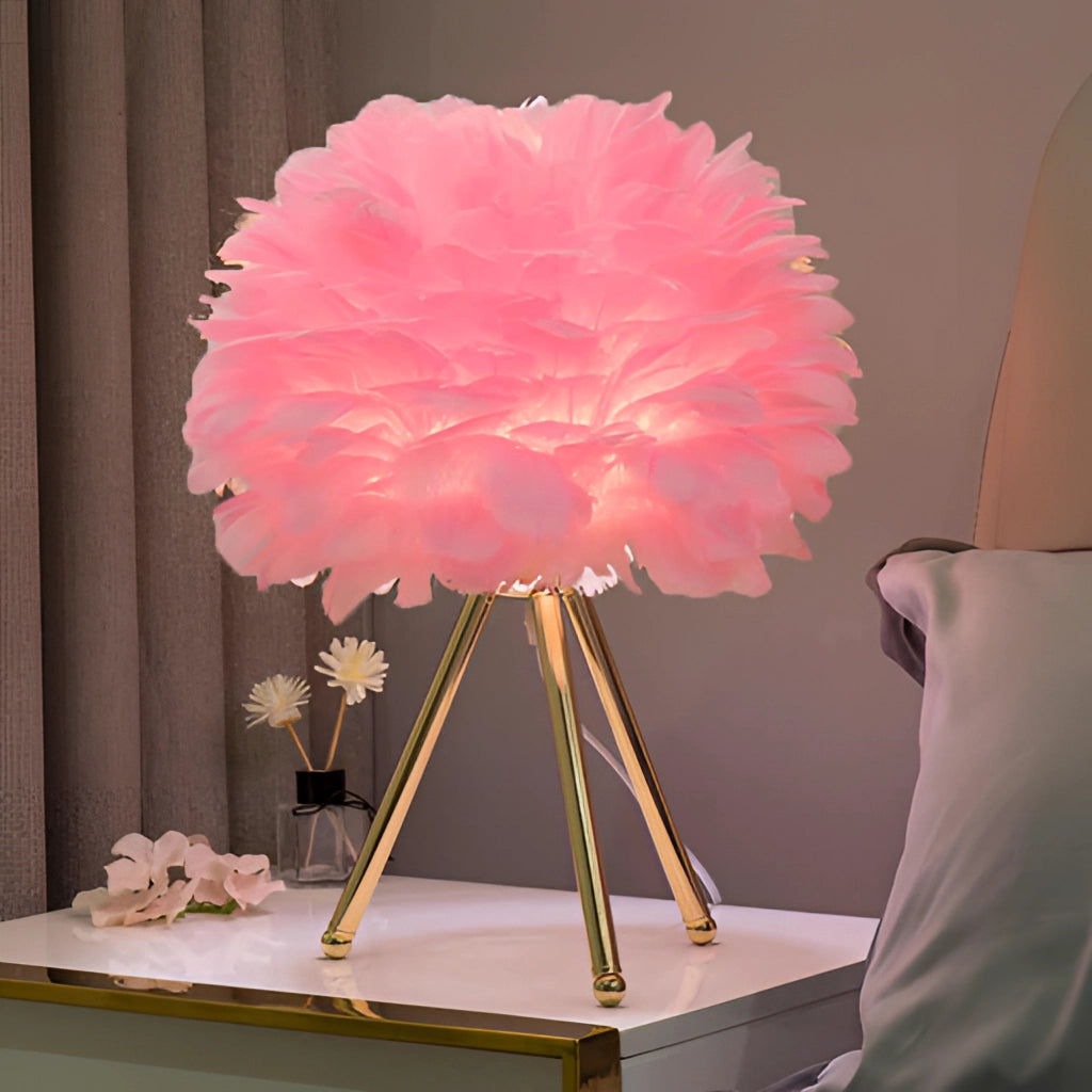 A Rosa Feather LED Table Lamp with Dimmable Lighting, featuring delicate pink and orange petals, placed on a table in an elegantly designed interior.