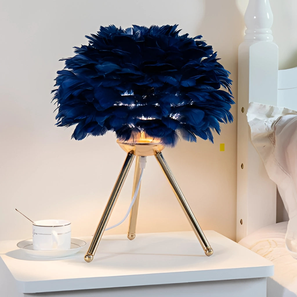 Blue Feather LED Table Lamp with Dimmable Lighting featuring artificial flowers on a table.