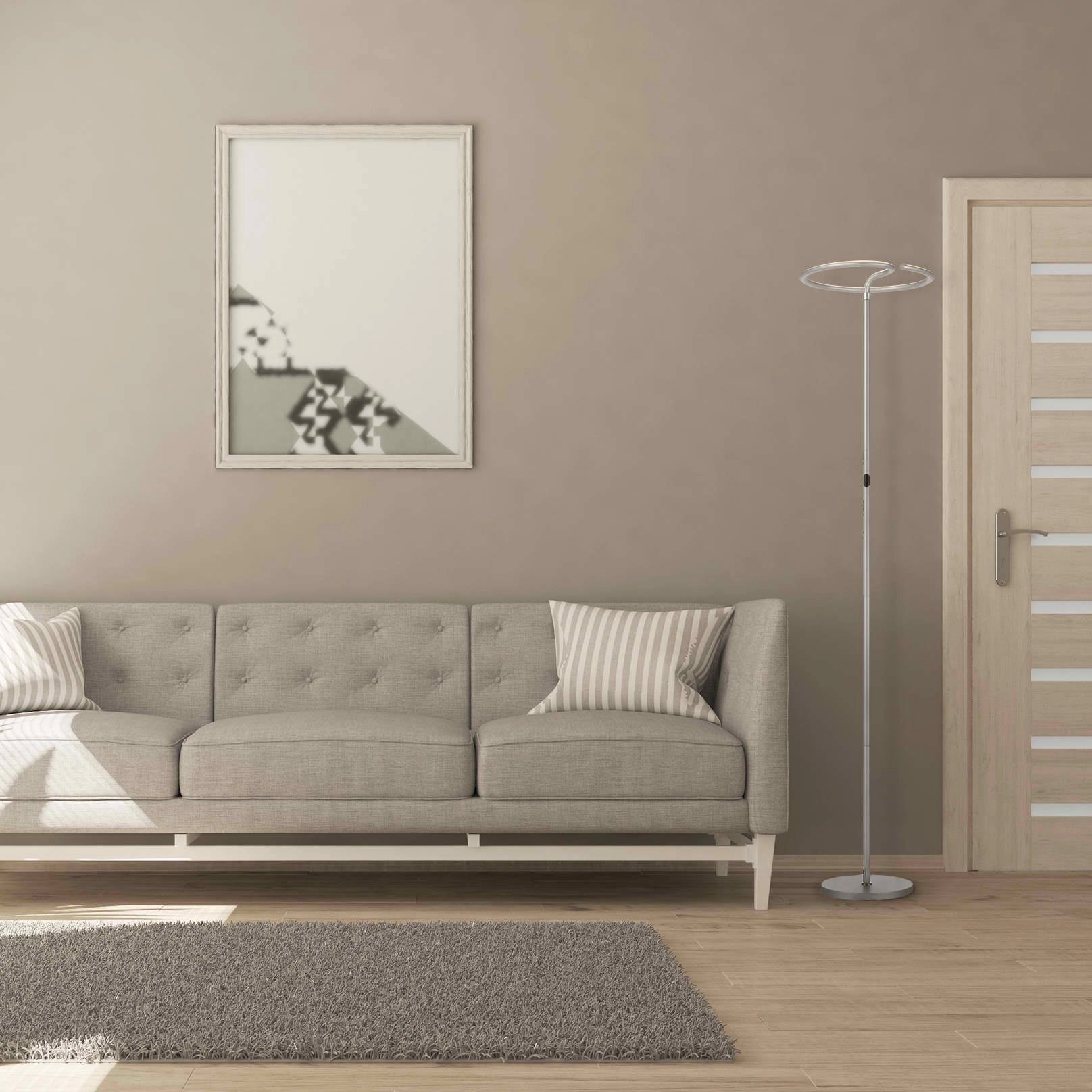 Modern energy-efficient LED floor lamp with a touch dimmer feature, designed in a sleek metal finish, standing in a cozy living room with grey flooring, a grey couch, and wooden accents.