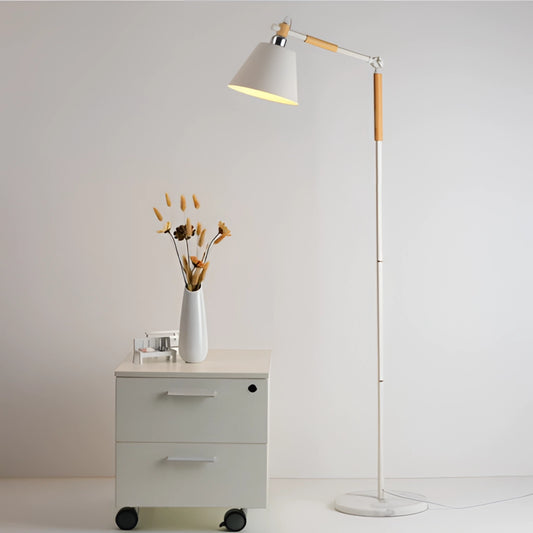 Floor lamp with marble base and versatile lighting next to a dresser with plants and flowers on top.