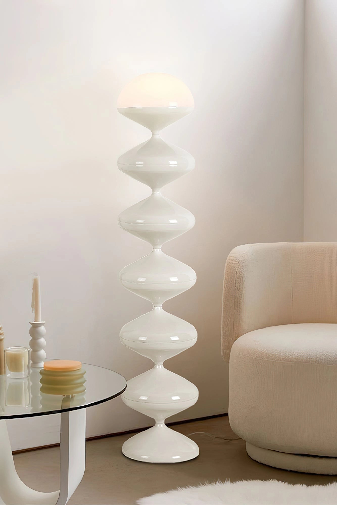 Modern floor lamp with twisted gourd design in beige, placed on wooden flooring in a contemporary interior setting.