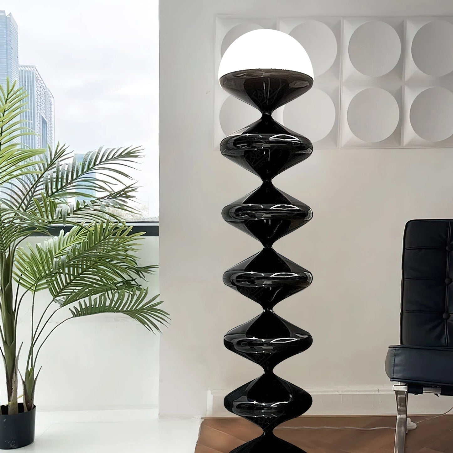 Modern elegant floor lamp with twisted gourd design in a stylish interior setting, featuring a white and black color scheme, surrounded by plants and flowerpots.
