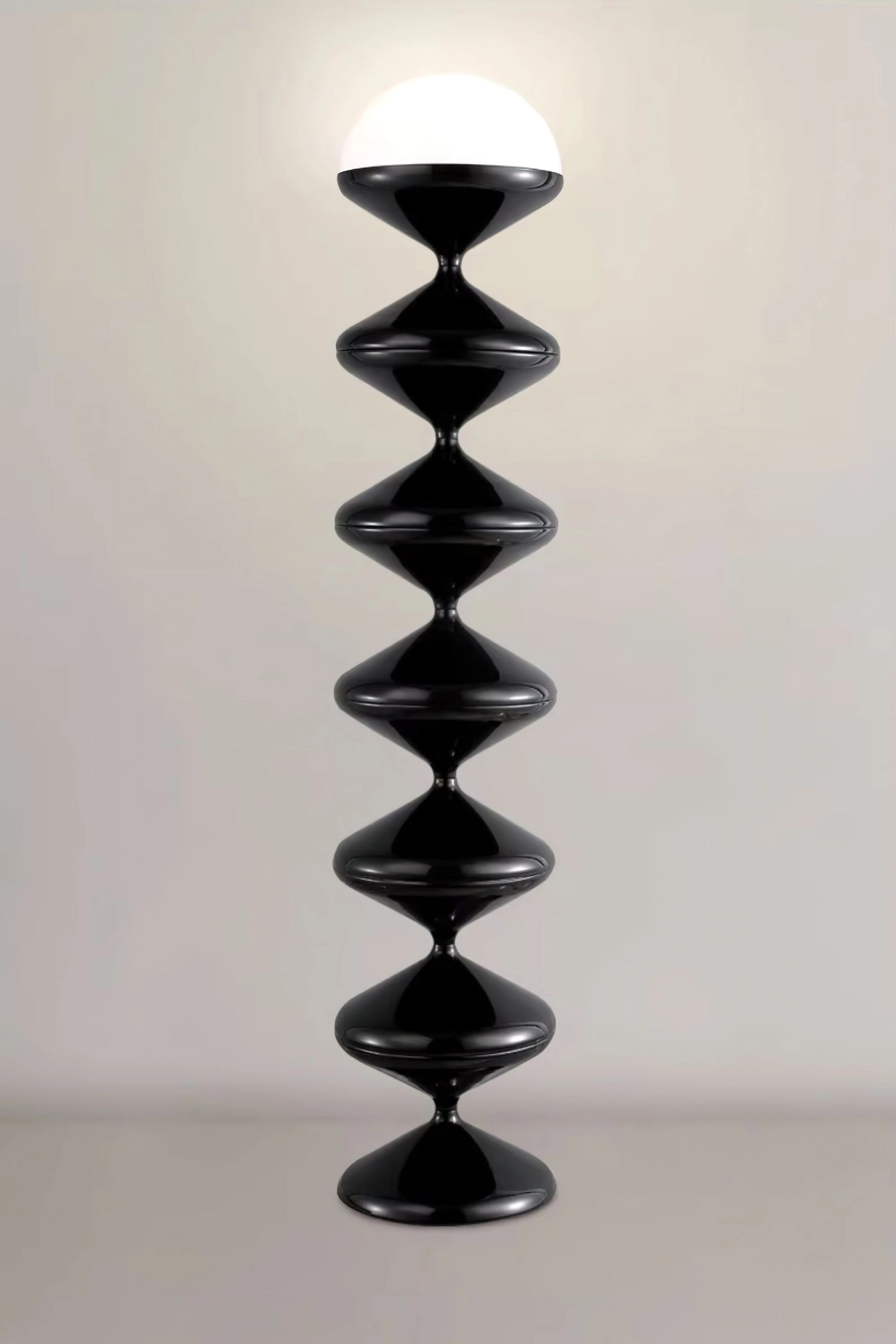 Modern elegant floor lamp with twisted gourd design, featuring a sleek electric blue glass body and metal accents, resembling a sculptural art piece.