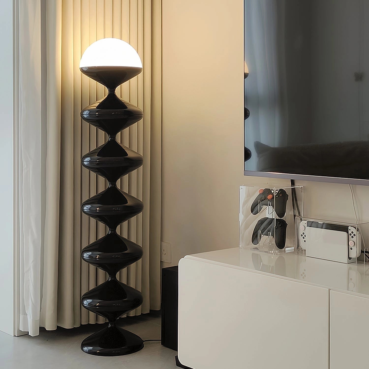 Modern elegant floor lamp with twisted gourd design in a well-decorated interior featuring wooden shelves and hardwood flooring.