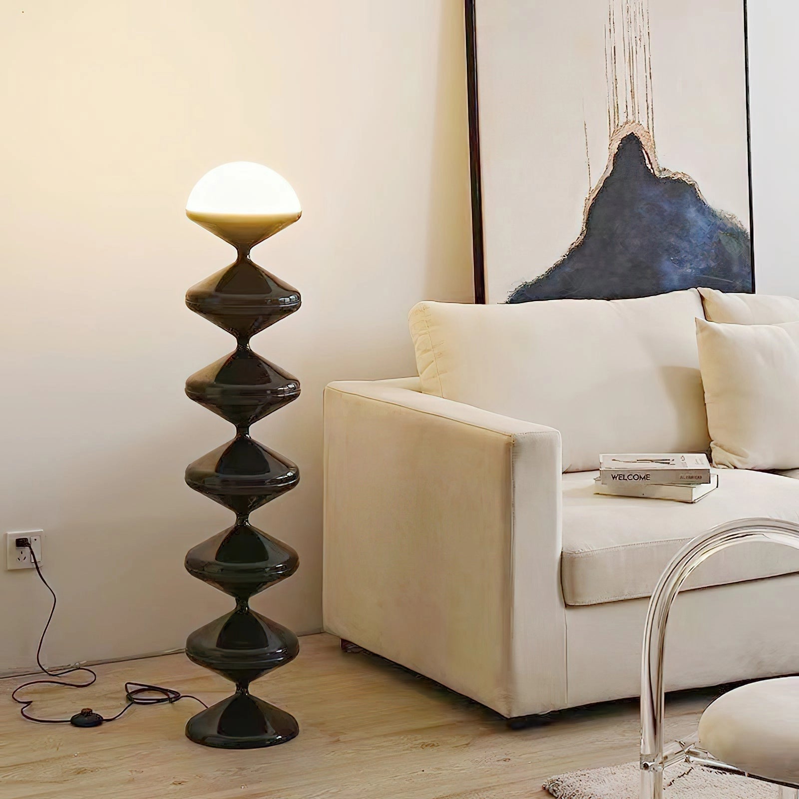 Modern elegant floor lamp with a twisted gourd design in beige, placed on a wooden floor next to a shelf, enhancing the interior design.