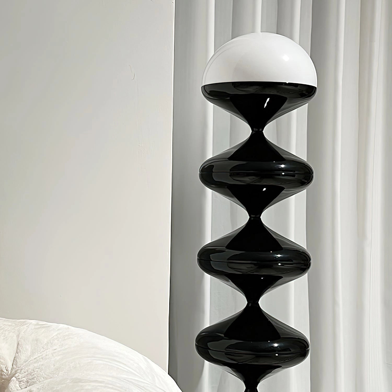 Modern elegant floor lamp with a twisted gourd design, featuring a rectangle base, wooden and metal elements, symmetrical pattern, and glass accents.