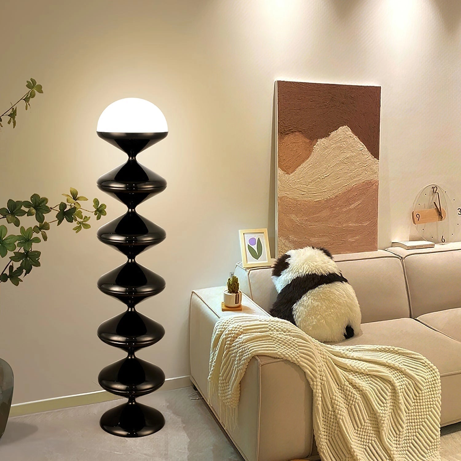 Modern elegant floor lamp with twisted gourd design, positioned in a stylish living room interior featuring wooden flooring and shelving.