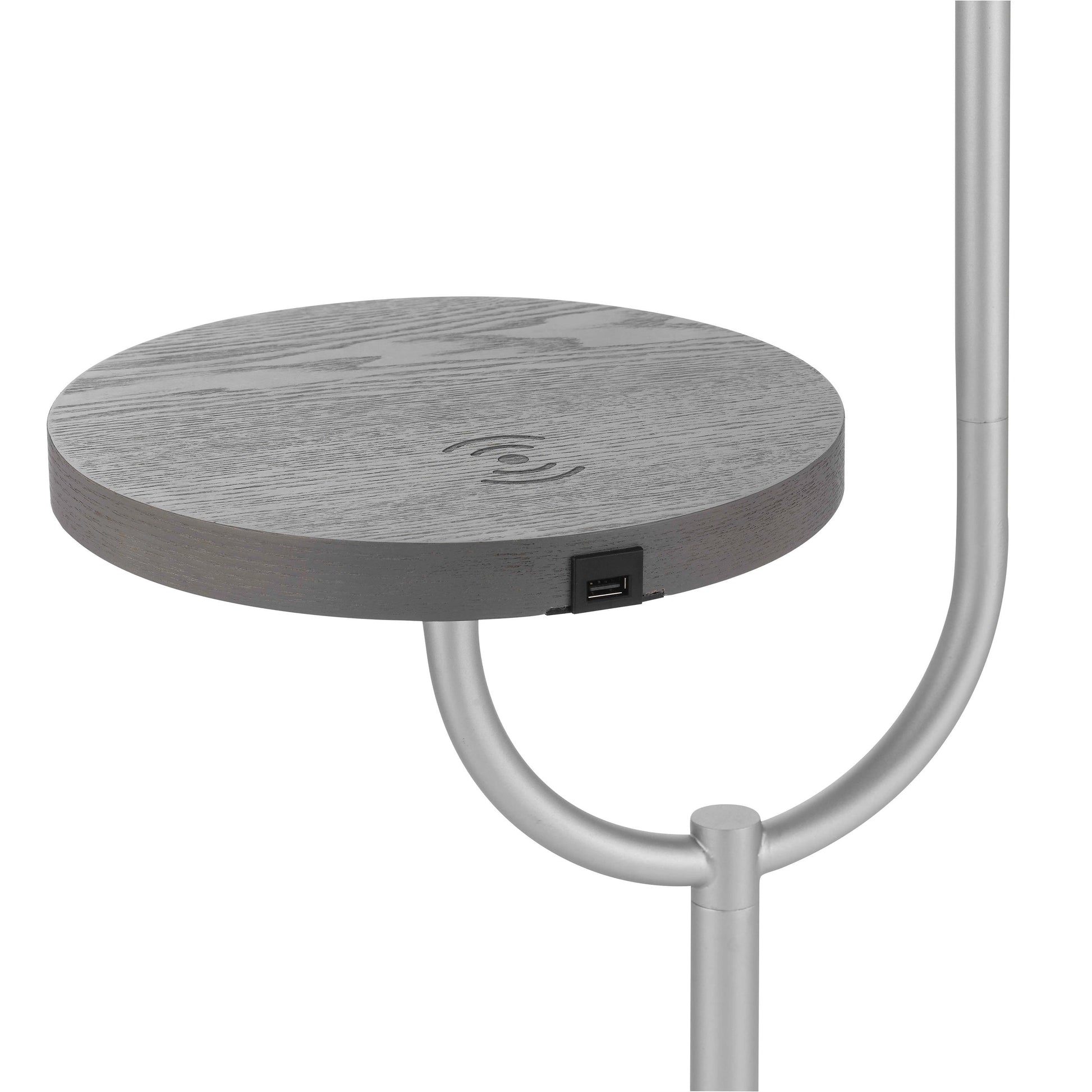 A modern floor lamp featuring a rectangular table top shelf with integrated wireless charging, made from metal and aluminum materials.
