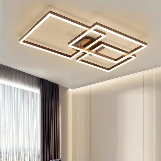 Geometric Aluminum Pendant Light with LED Technology hanging from a ceiling, featuring a modern artistic design with a rectangular shape. The background includes wooden elements and curtains.