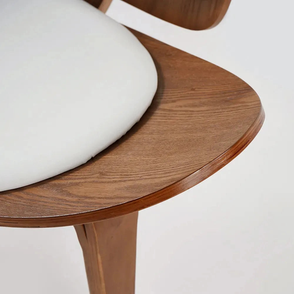 Geometric Retro Accent Chair for Modern Spaces made of hardwood with natural wood stain finish, displayed in a cozy room setting.