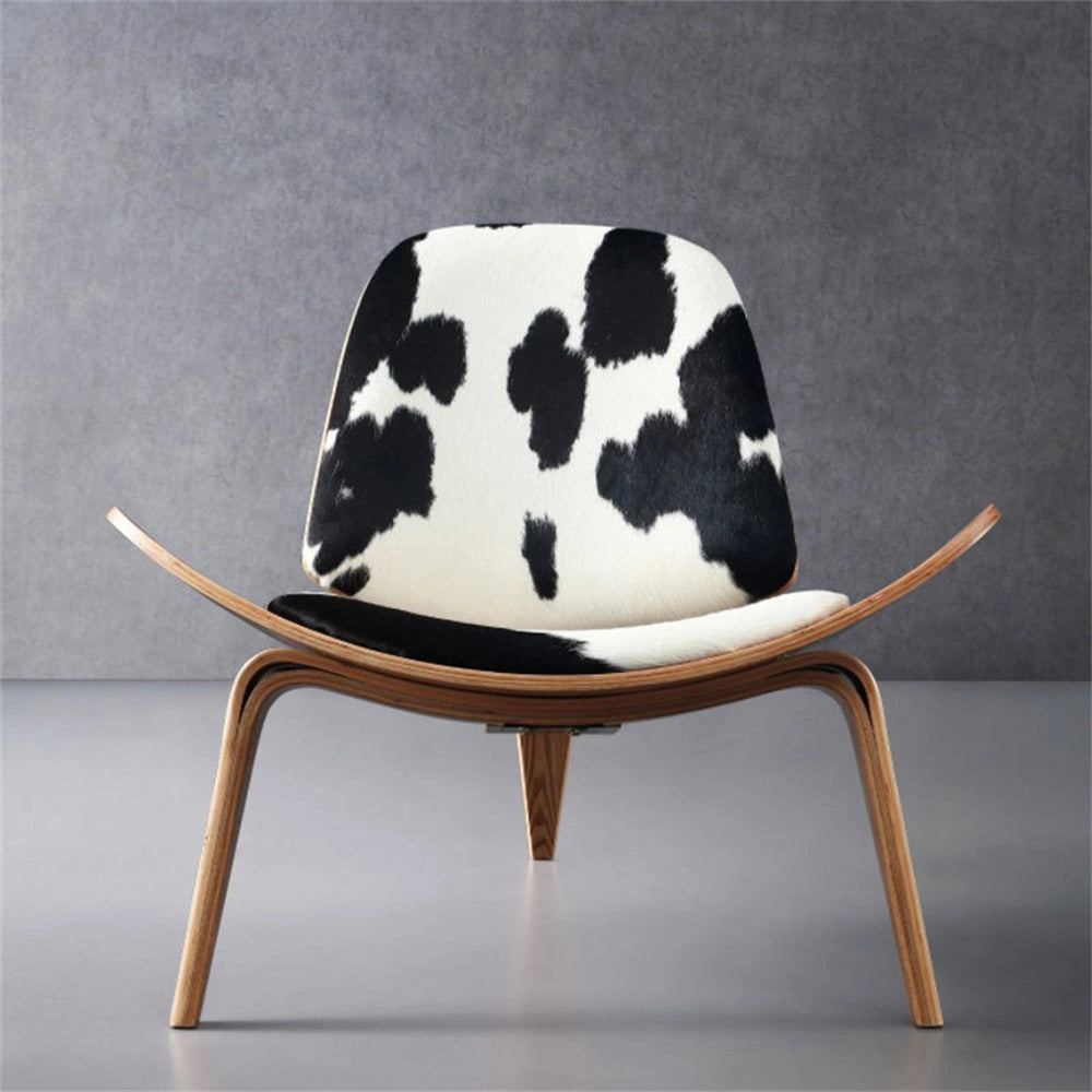 Geometric Retro Accent Chair for Modern Spaces in Black and White with a rectangular pattern, wooden legs, and comfortable cushioning, placed on a stylish floor.