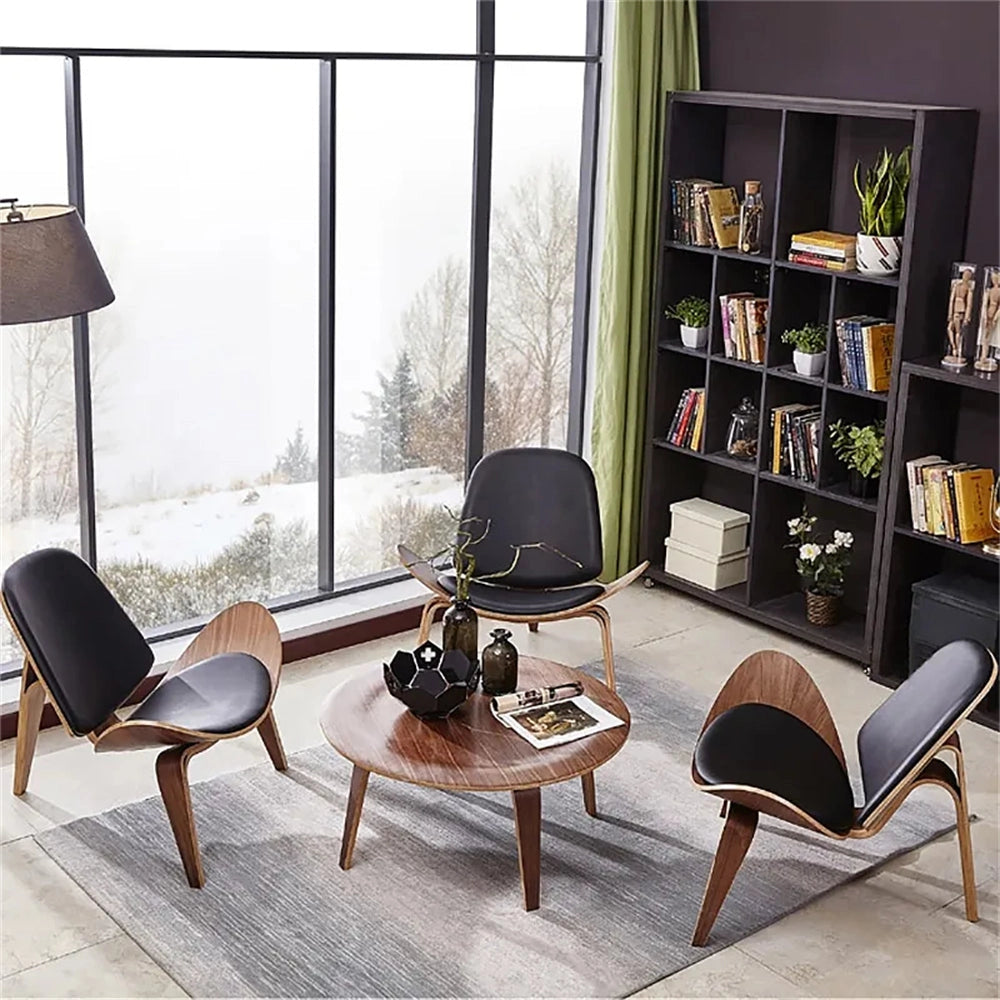 Geometric Retro Accent Chair in a modern living room with wooden floor, surrounded by a small table and a potted plant.