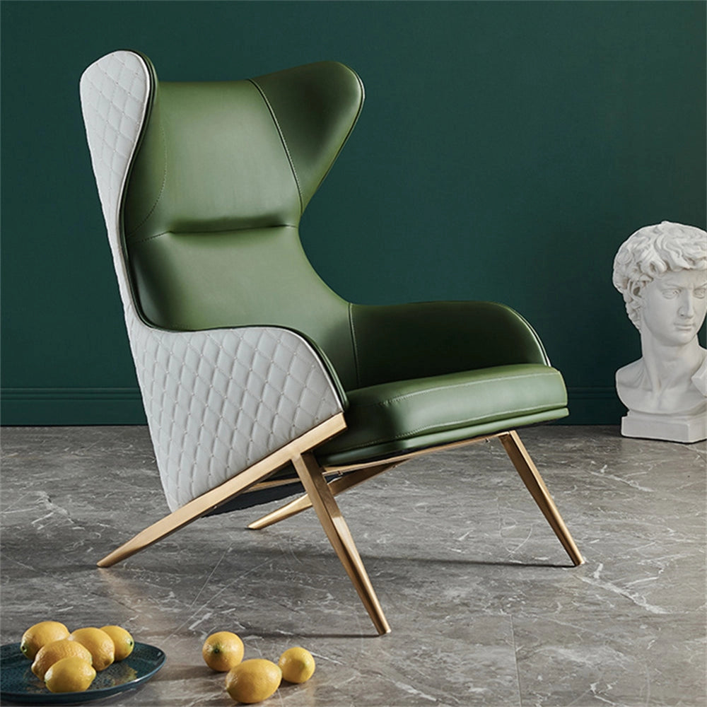 Geometric wingback accent chair with gold trestle base in green, featuring armrests and a modern design suitable for indoor use.