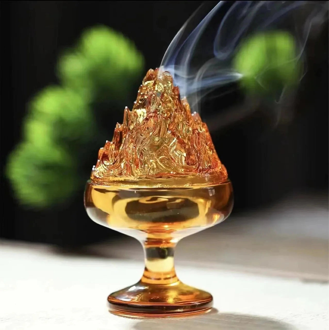 Amber Glass Incense Burner with a fluid-like design, ideal for Zen home decor.