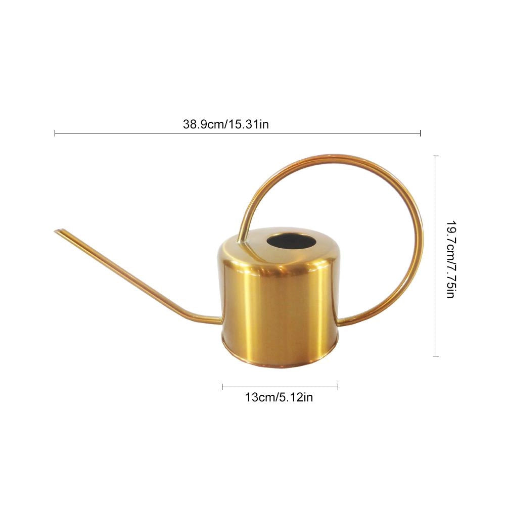 Gold stainless steel watering can for plant care placed on a table.
