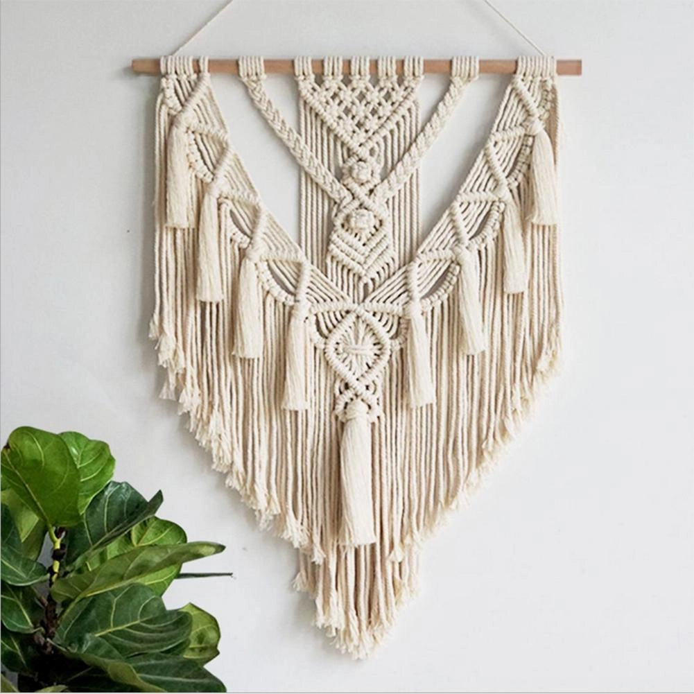 Handwoven macrame boho wall hanging tapestry featuring geometric art design with wooden dowel at the top.