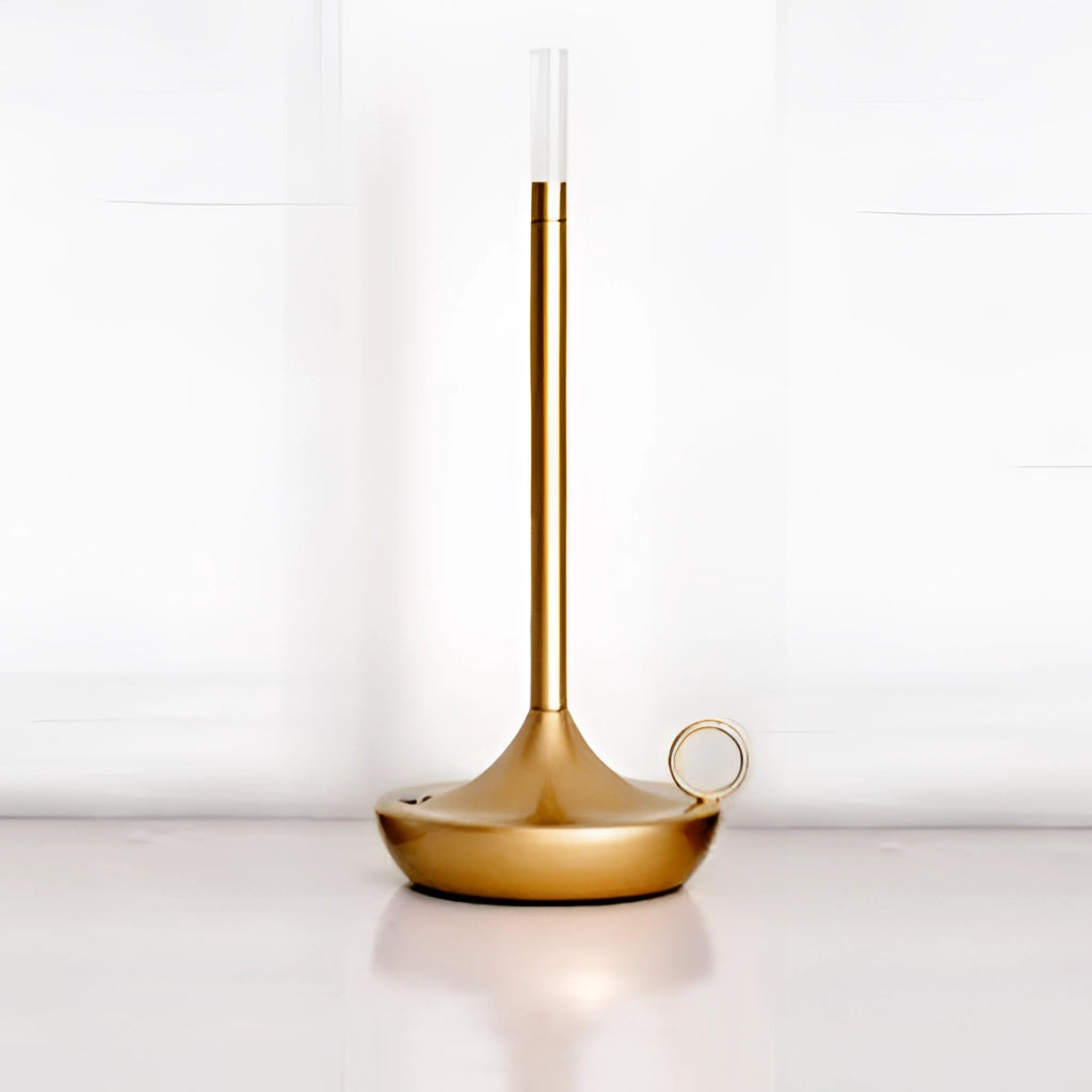 Gold Iron Lamp with Unique Candle Design and 3-Level Dimming Option on a Wooden Table in a Stylish Interior Setting.