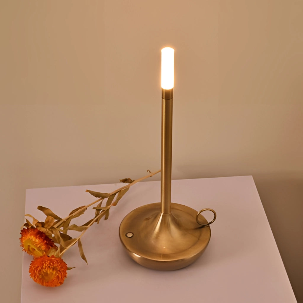 Iron lamp with unique candle design featuring a 3-level dimming option, placed on a wooden table, showcasing a circular base and candle holder elements.