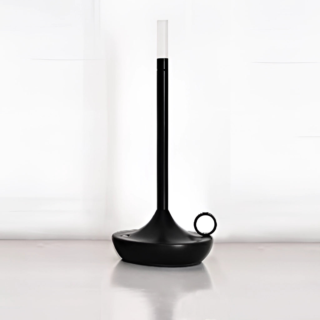 Black iron lamp with unique candle design and 3-level dimming option placed on a floor, casting shadows.