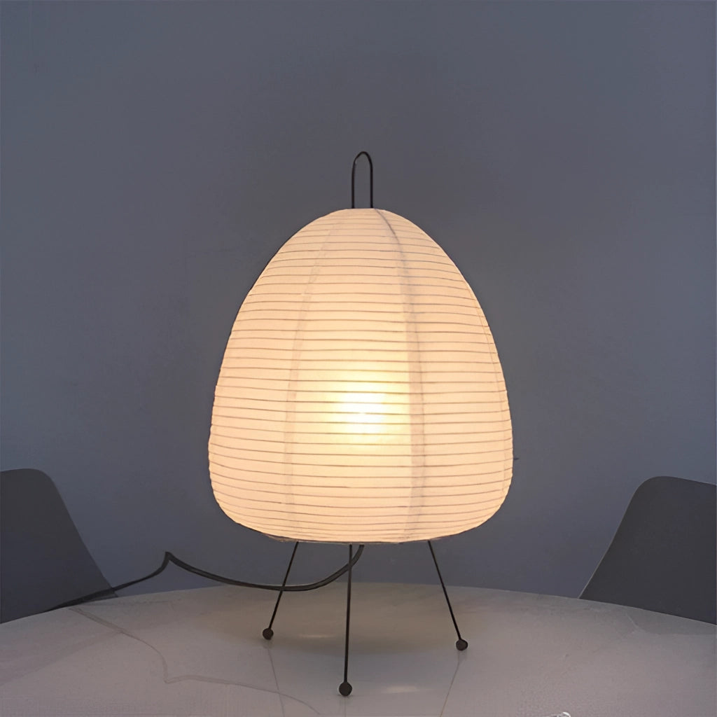 Japanese Rice Paper Table Lamp with wooden base and circular shade, placed on a table.