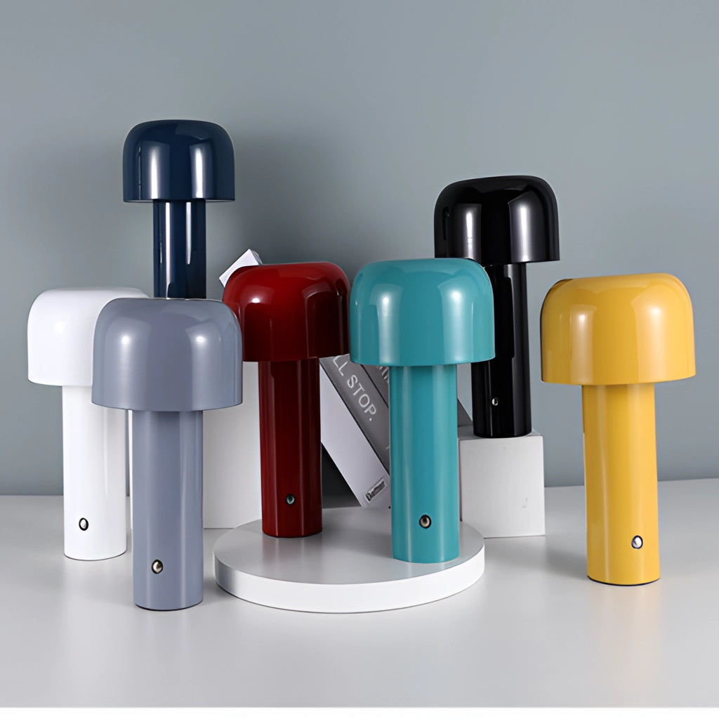 LED cordless table lamp with unique mushroom design featuring a sleek, cylindrical base and a smooth, fluid-like surface.