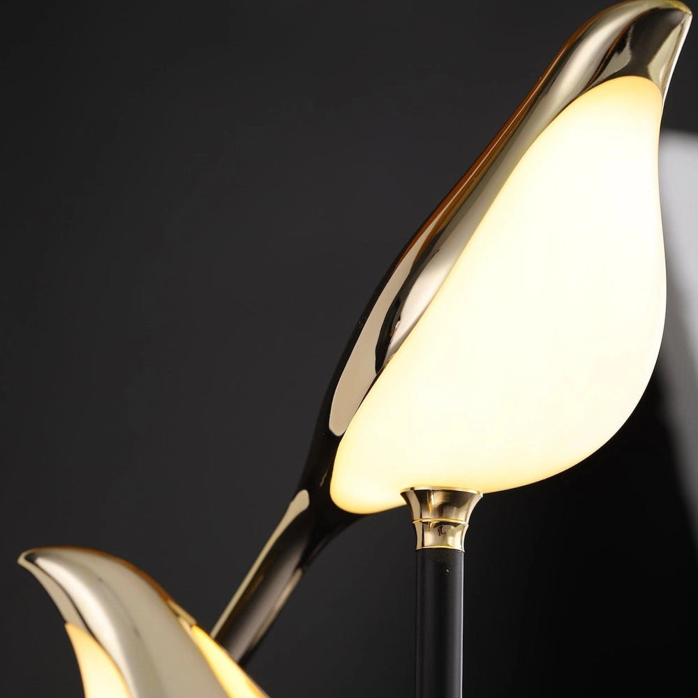 LED desk lamp with postmodern galvanized golden bird design, featuring a sleek metal body and bird-shaped accents.