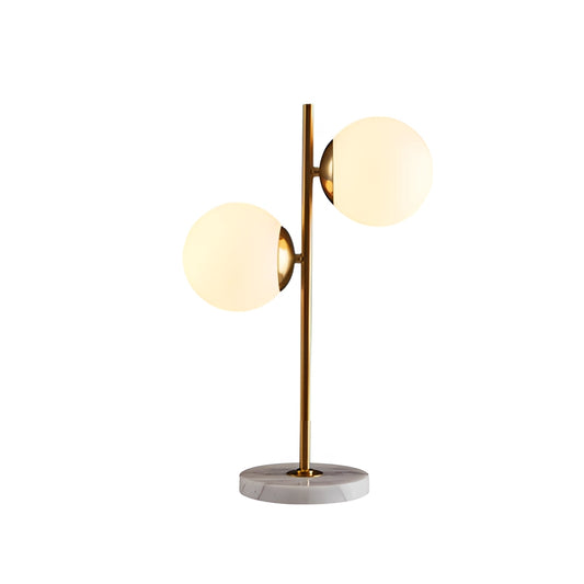 LED desk lamp with smart touch control, featuring a sleek wood base, circular lampshade, and energy-saving light fixture, placed on a desk next to a small plant.