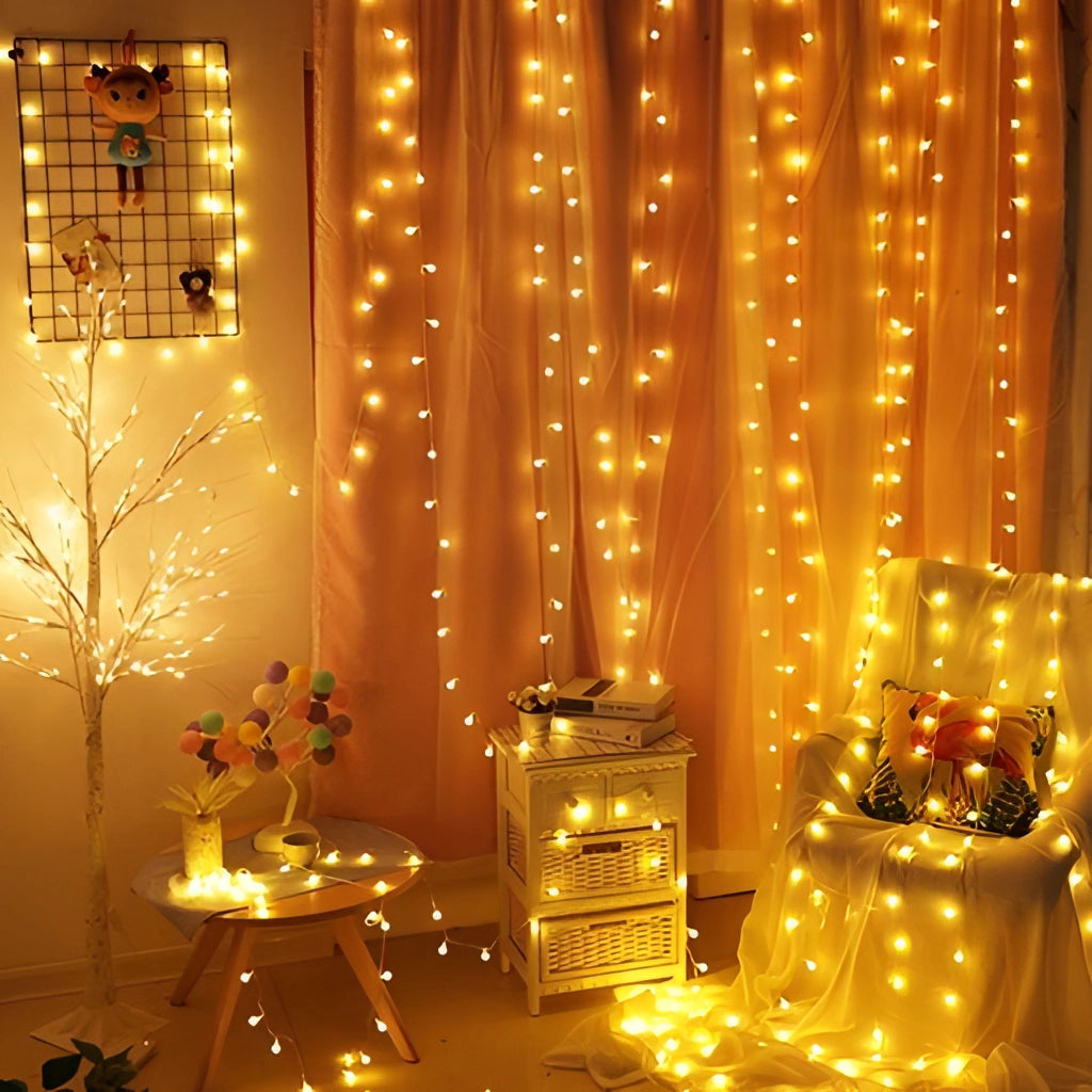 LED Fairy String Lights illuminating a lush green plant, creating a romantic ambiance with their warm amber glow, perfect for decorations, events, and Christmas.