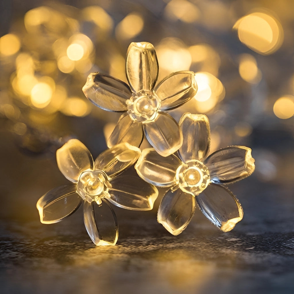 Warm white LED fairy string lights with flower-shaped bulbs, 10 meters long, featuring 100 LEDs, creating a twinkling magical ambiance, draped around a window with ornamental flowers and gold accents.