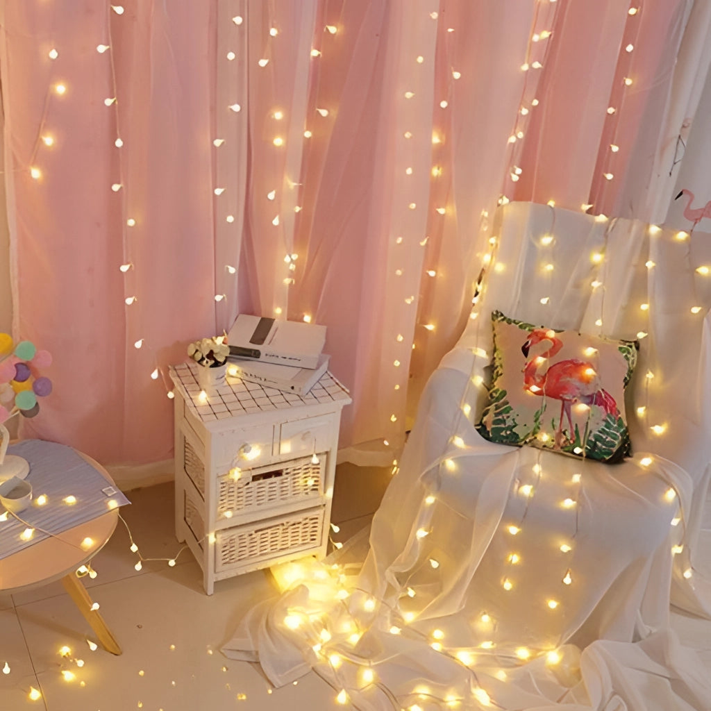 LED fairy string lights decorating a plant indoors, creating a romantic ambiance with twinkling lights, suitable for events and Christmas decorations.