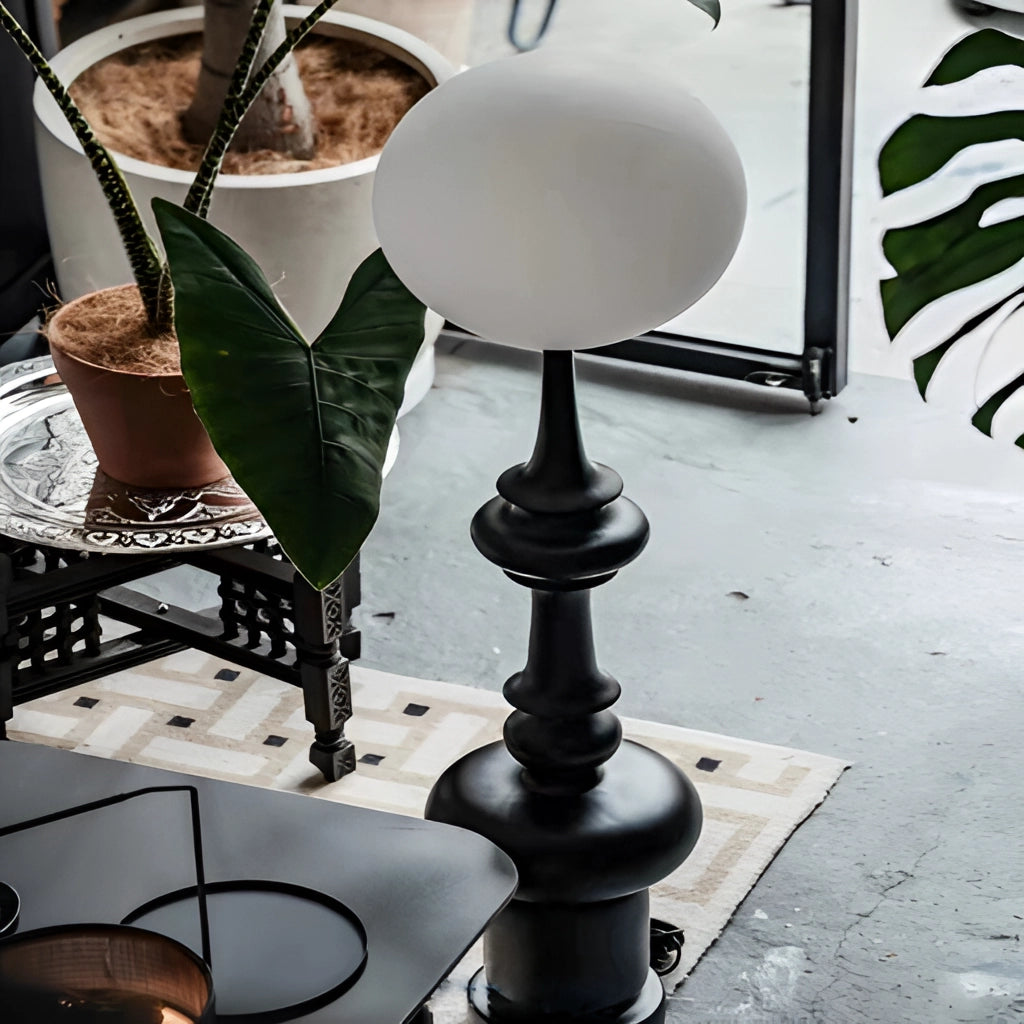 LED floor lamp with two usage modes in a modern interior setting featuring wooden flooring and a stylish table with tableware and drinkware.