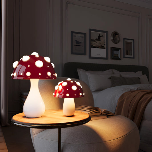 LED Mushroom Table Lamp with Warm White Light on a wooden table in a cozy interior setting with picture frames and comfortable textiles.