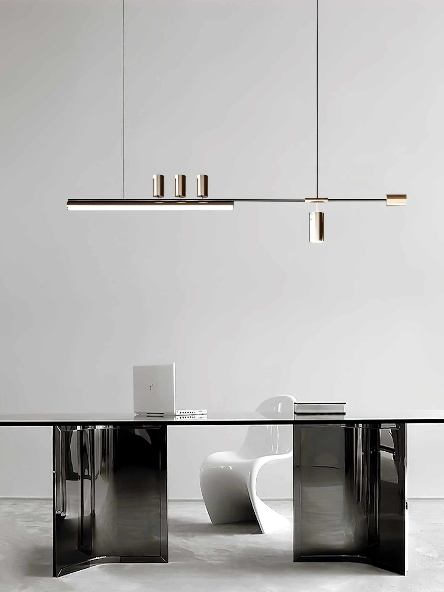 Nordic-inspired LED pendant light with adjustable wire, warm and cool light options, hanging above a modern grey table and chairs in a stylish interior setting.