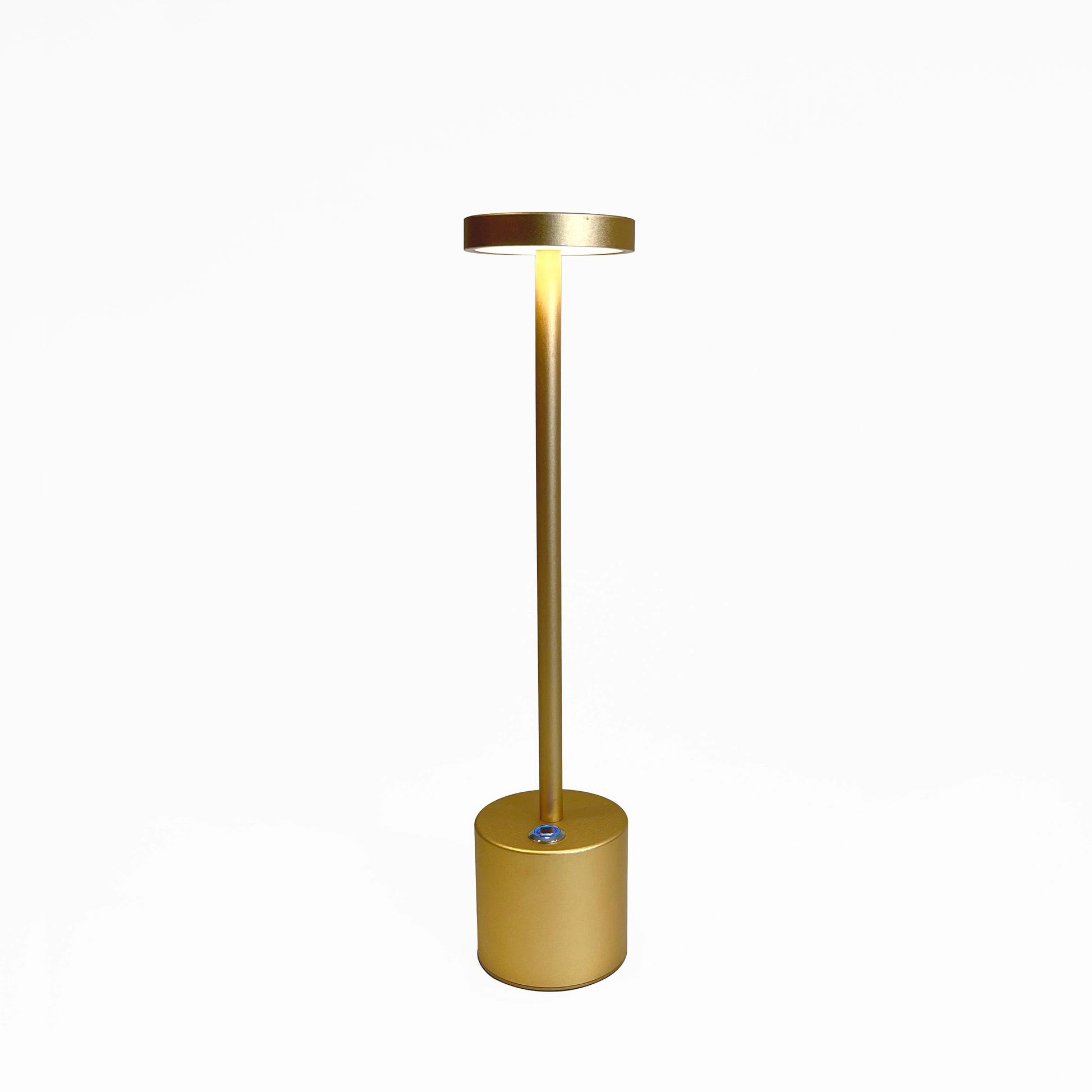 LED Portable Table Lamp with Resilient Design featuring a cylindrical shape, metallic and wooden elements, shown as a still life photography.