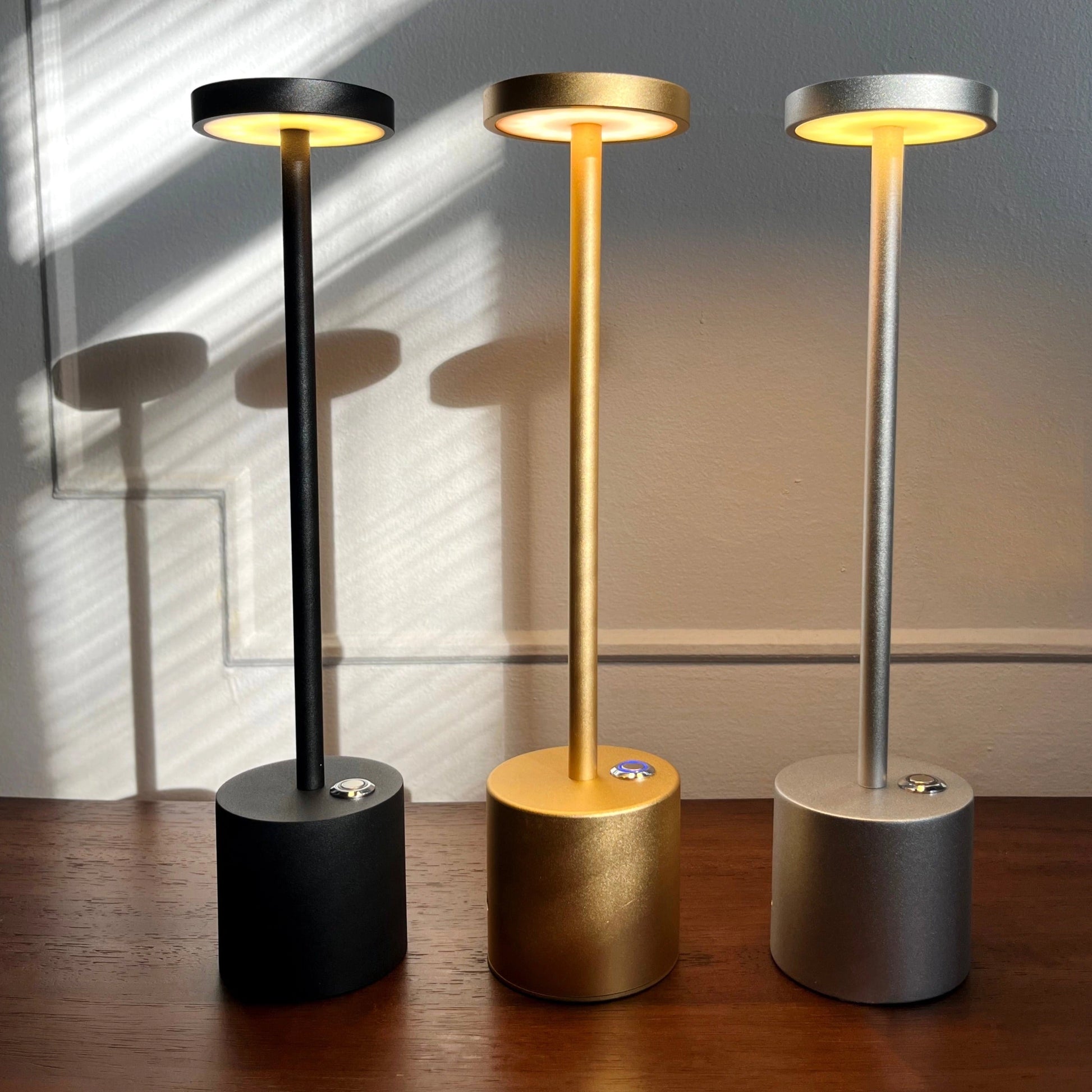 LED Portable Table Lamp with Resilient Design featuring a cylindrical wooden base and circular light, placed on wooden flooring.