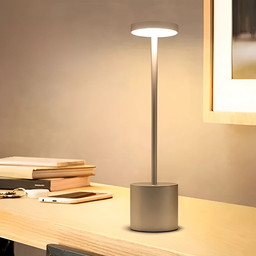LED Portable Table Lamp with Resilient Design featuring a sleek wooden base, placed on a table in a modern interior setting.