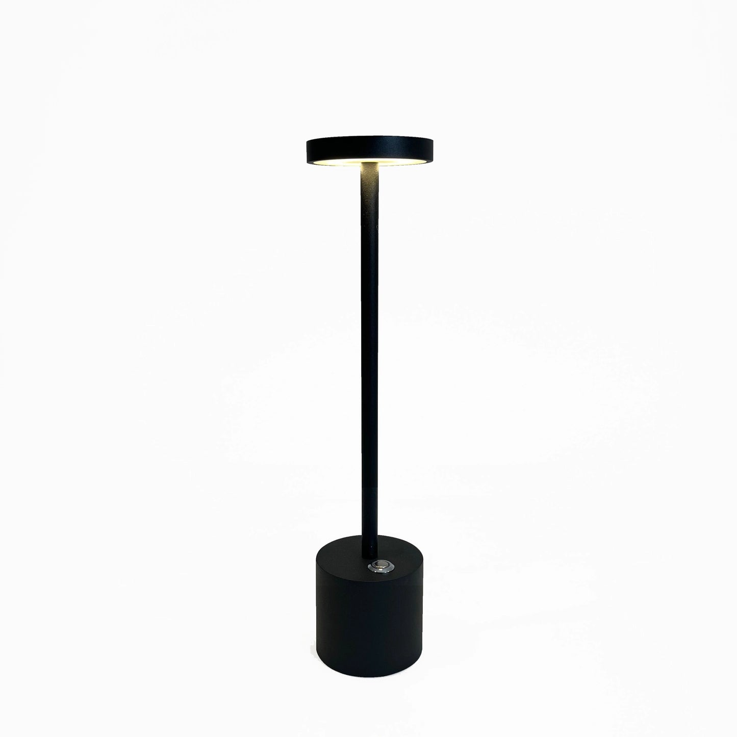 LED Portable Table Lamp with Resilient Design in Black, featuring a sleek and minimalist cylindrical shape, balanced on a circular base, with a modern aesthetic suitable for various settings.